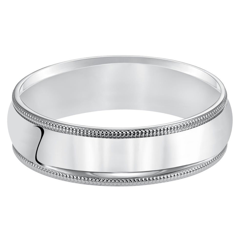 Classic styling is infused into this low-dome, Comfort Fit wedding band design featuring a high polished finish with delicate milgrain detailing