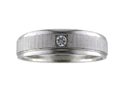 Comfort Fit wedding band with single diamond, vertical brushed finish and bright, rolled edges