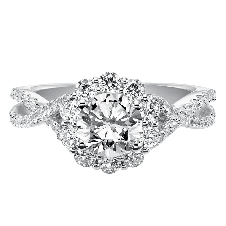 Awe-inspiring sparkle illuminates from this engagement ring featuring a shared prong set diamond halo and elegant twisted diamond band for grand effect..  Center Stone is not included.