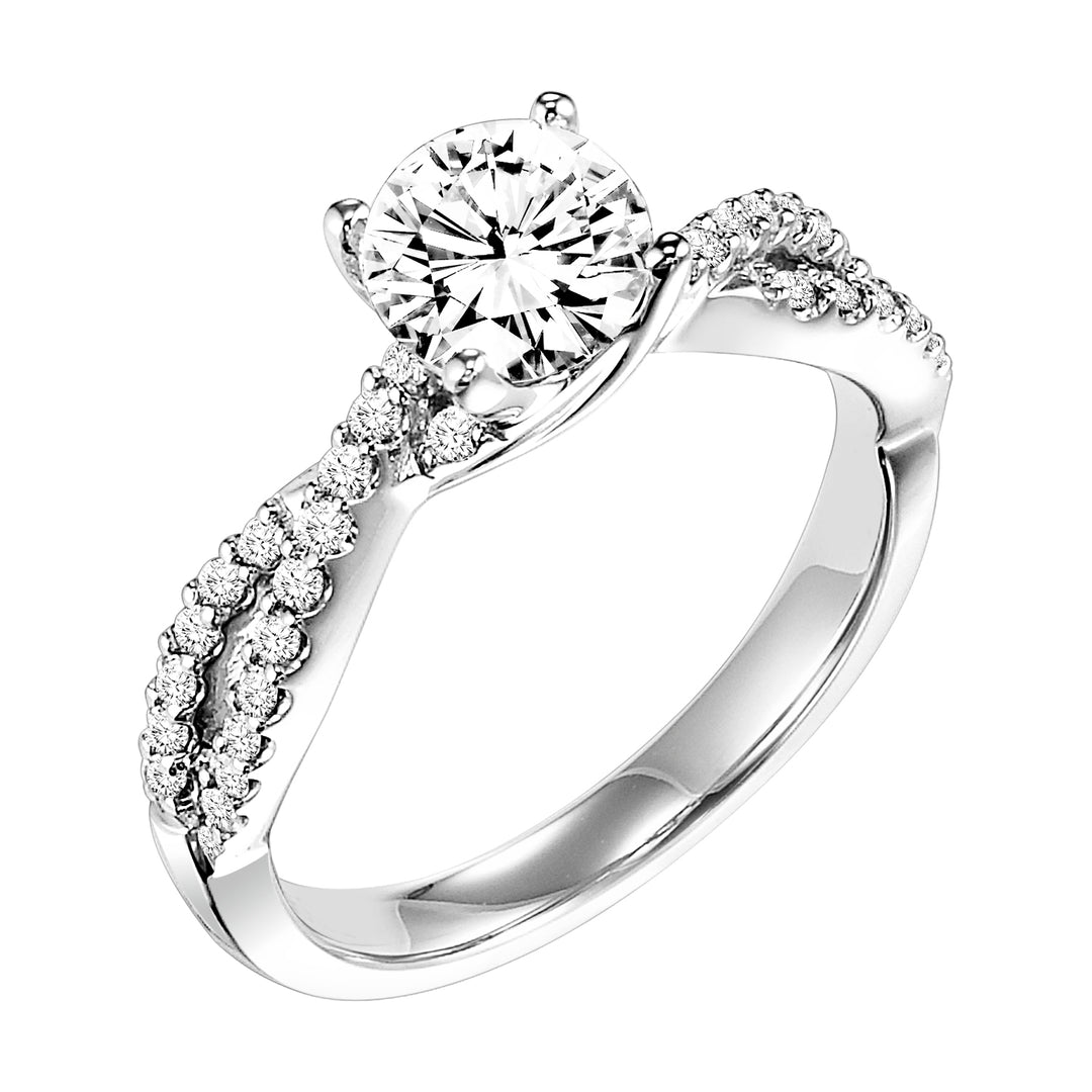 This engagement ring features a diamond prong set band with a delicate twist design elegantly leading up to the round center diamond for an alluring look
