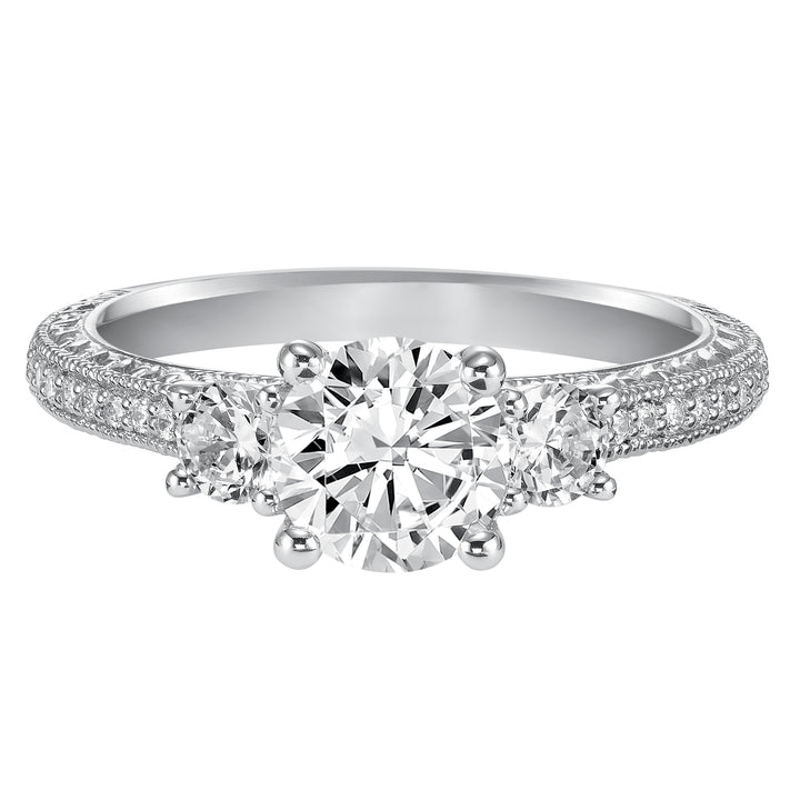 This eye-catching 3-stone engagement sparkles with its diamond prong set band with engraving and milgrain details.  Center Stone is not included.