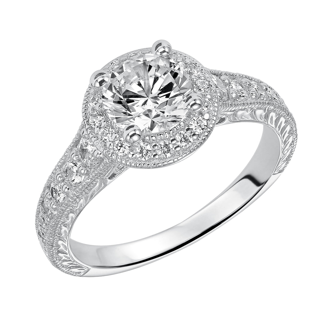 This show-stopping engagement ring is sure to impress with its diamond prong set halo and band with milgrain and engraving.  Center Stone is not included.