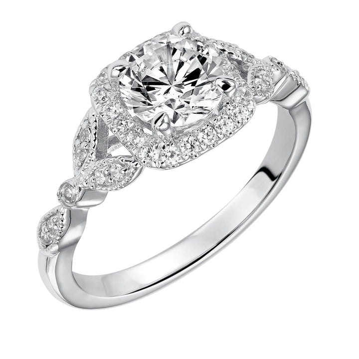 This whimsically styled engagement ring sparkles with its filigree and diamond halo and diamond prong set floral-inspired band.  Center Stone is not included.