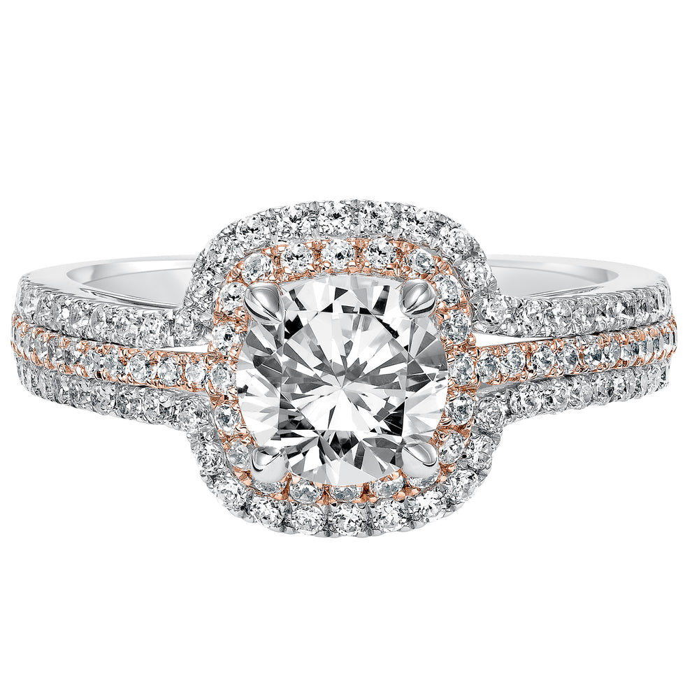 This engagement ring is truly breathtaking featuring both rose and white gold in its prong set diamond double halo and three row band design