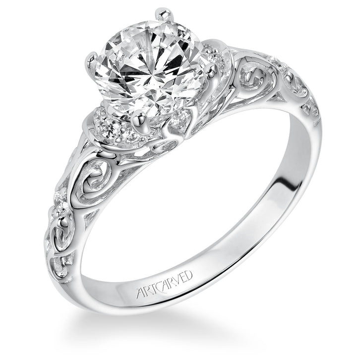 Diamond engagement ring with round center stone and carved diamond enhanced band.  Center Stone is not included.