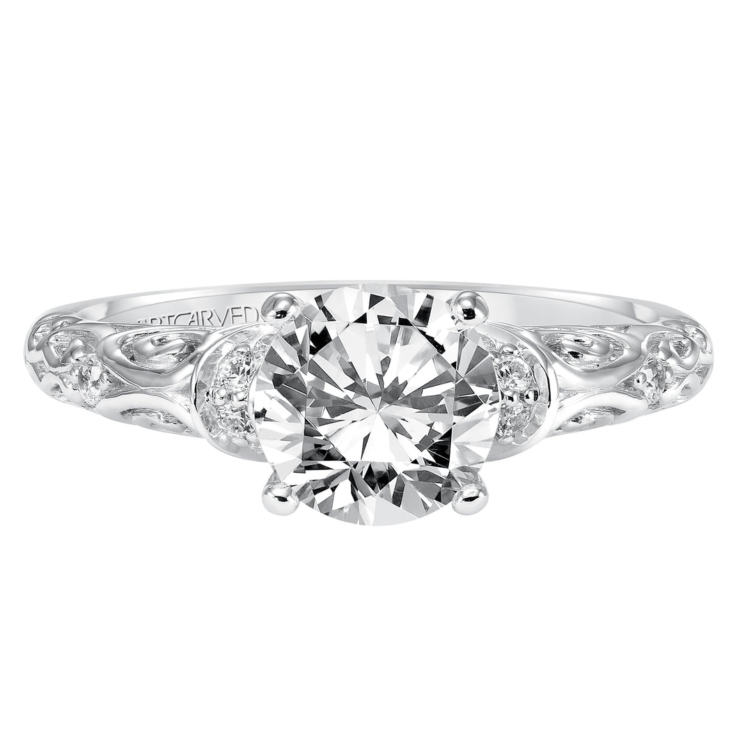 Diamond engagement ring with round center stone and carved diamond enhanced band.  Center Stone is not included.