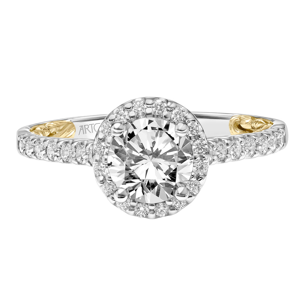 Lyric Engagement Ring with Round Diamond Halo and Accented Diamond Gallery with Inner Carved details and Diamond Shank.  Center Stone is not included.